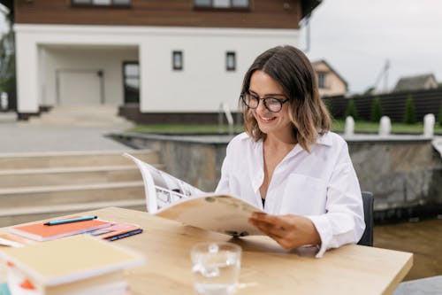 A Woman Looking at a Magazine