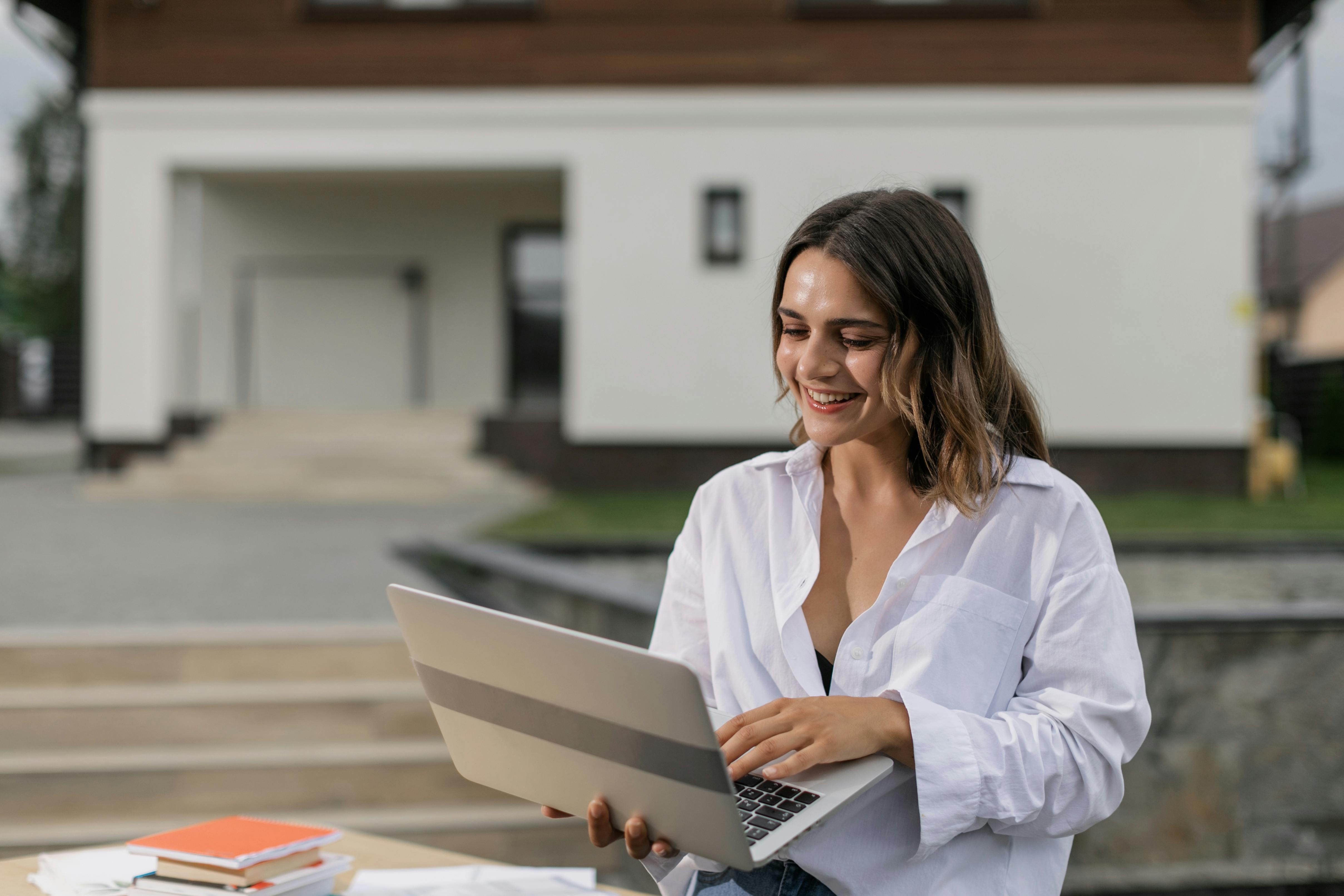A person holding a laptop