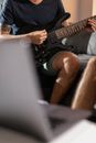 Man in Black T-shirt Playing Electric Guitar
