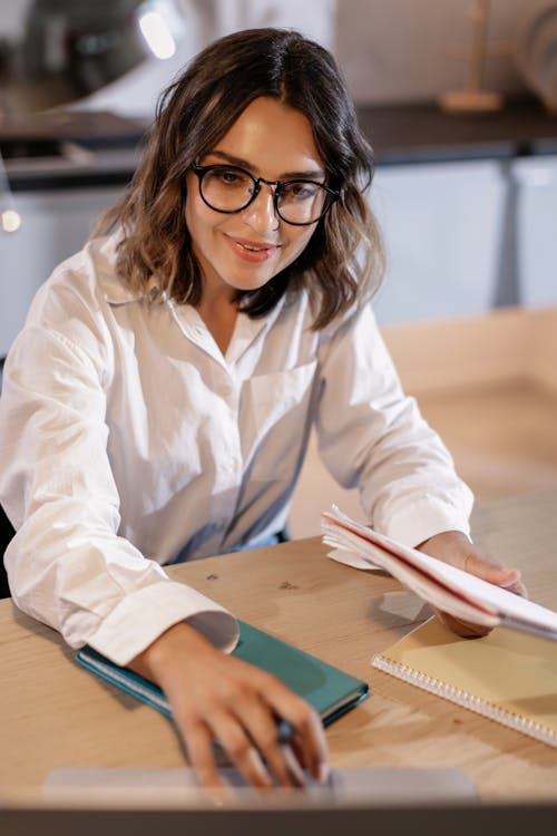 Woman in White Dress Shirt Wearing Black Framed Eyeglasses