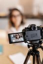 Black Dslr Camera on Black Tripod