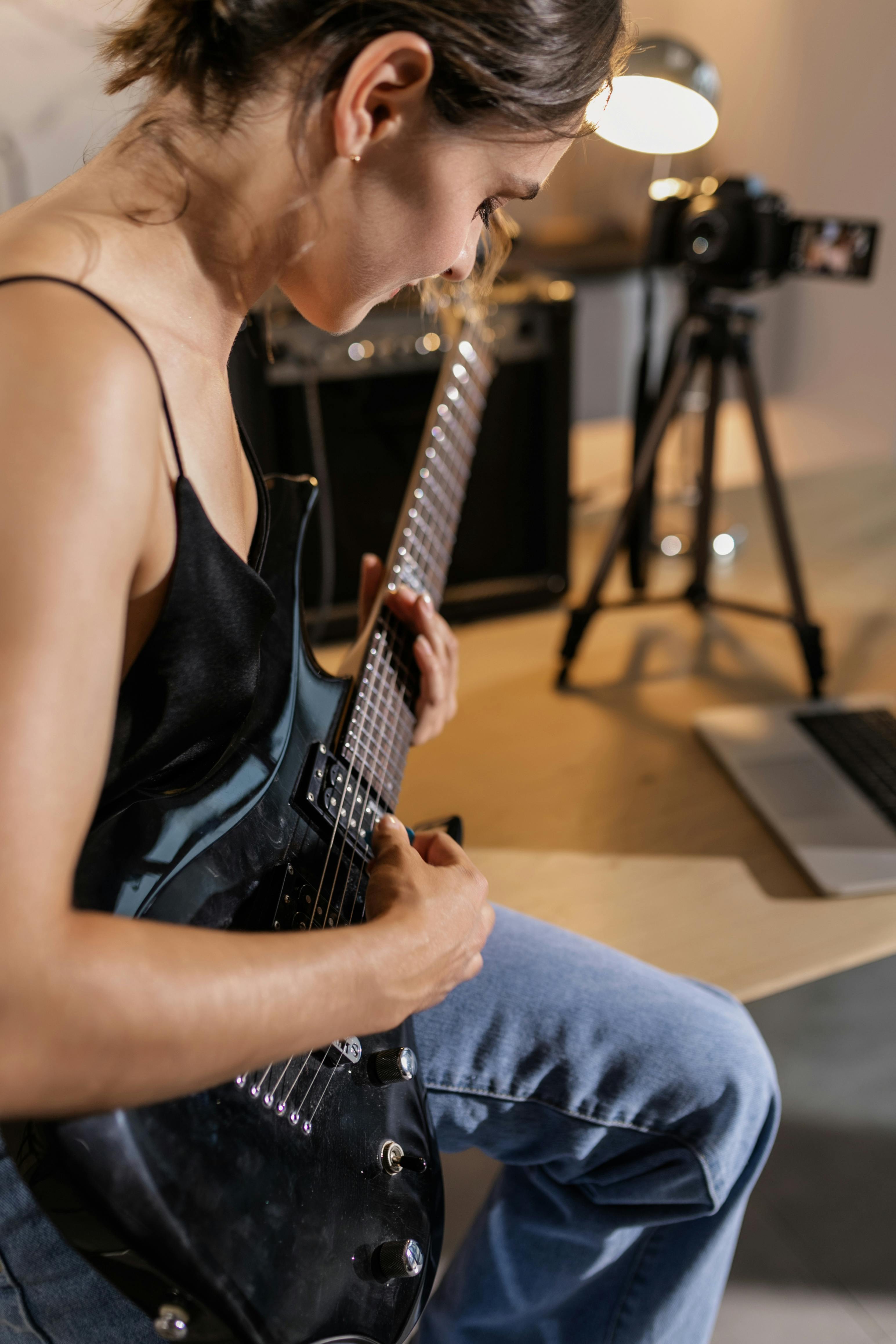 a woman playing electric guitar