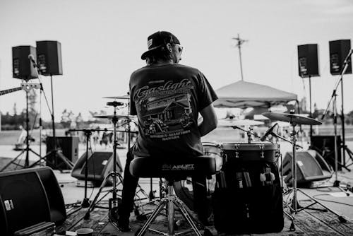 Grayscale Photo of a Drummer