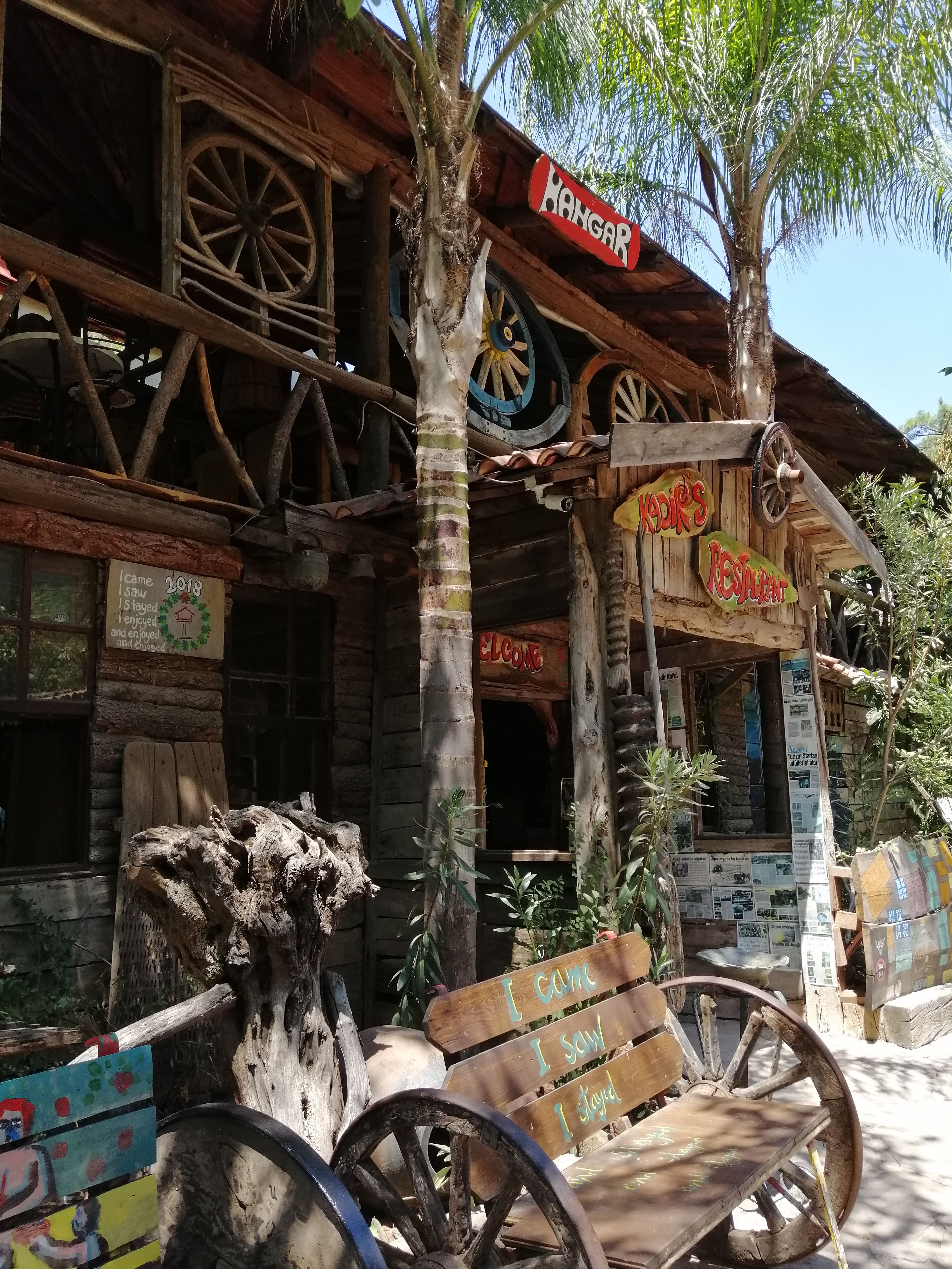 Charming wooden cafe with rustic decor and signage in Antalya, Turkey.