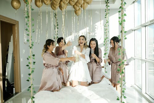 Happy Women Holding Wine Glasses