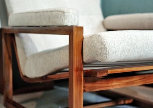 Close-up Shot of a Cushioned Wooden Chair