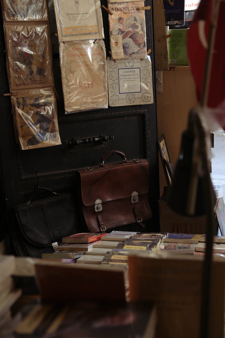 Vintage Comics And Secondhand Leather Bags On Display