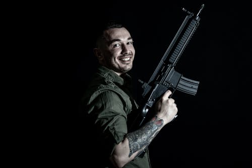Free A Man Holding a Rifle  Stock Photo