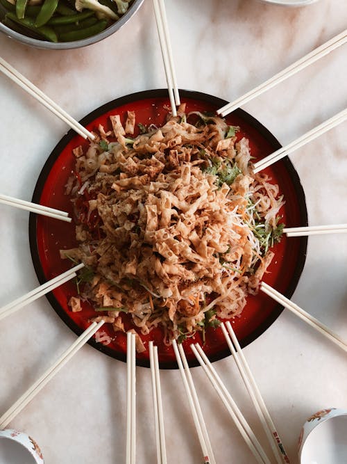 Pasta Served on Plate With Chopsticks