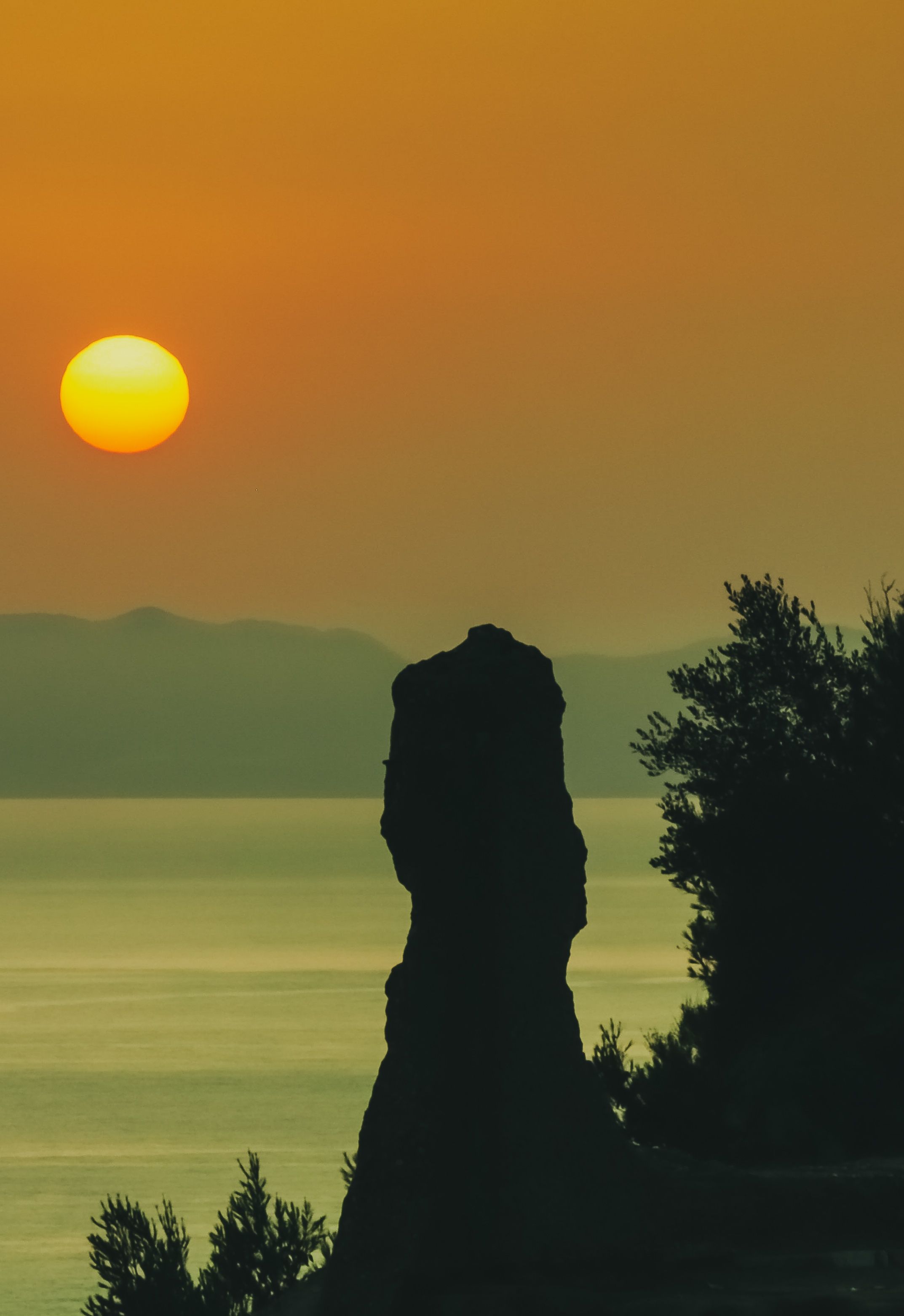 Silhouette of a Rock Formation During Golden Hour · Free Stock Photo