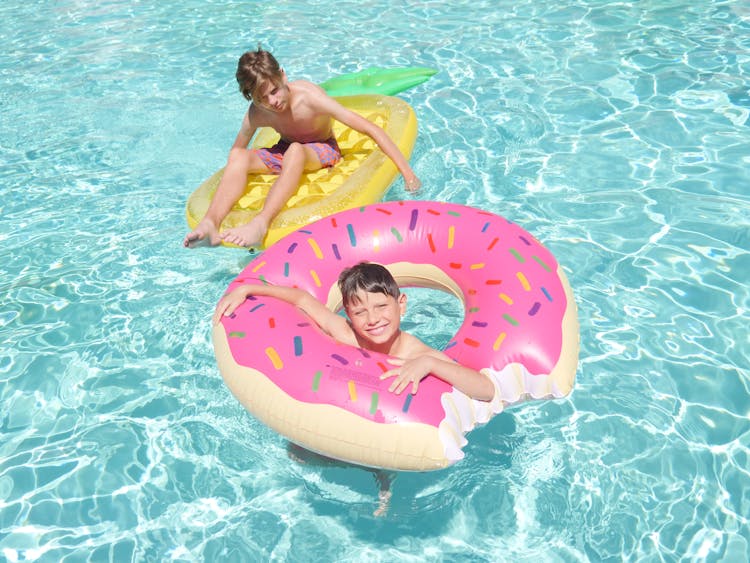 Boys Swimming In The Pool