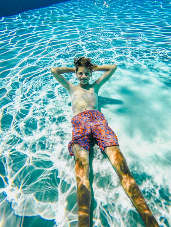 A Boy Posing Underwater