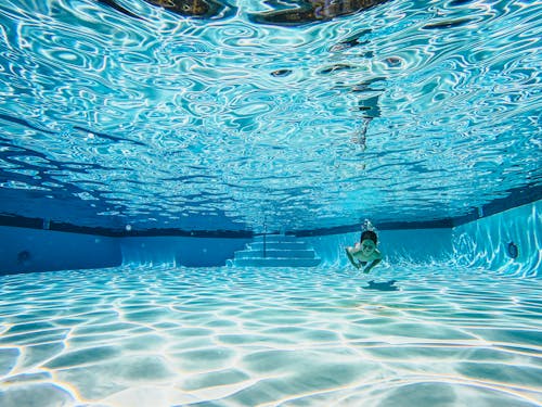 A Boy Swimming Underwater 