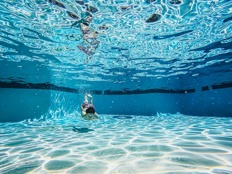 A Boy Swimming Underwater