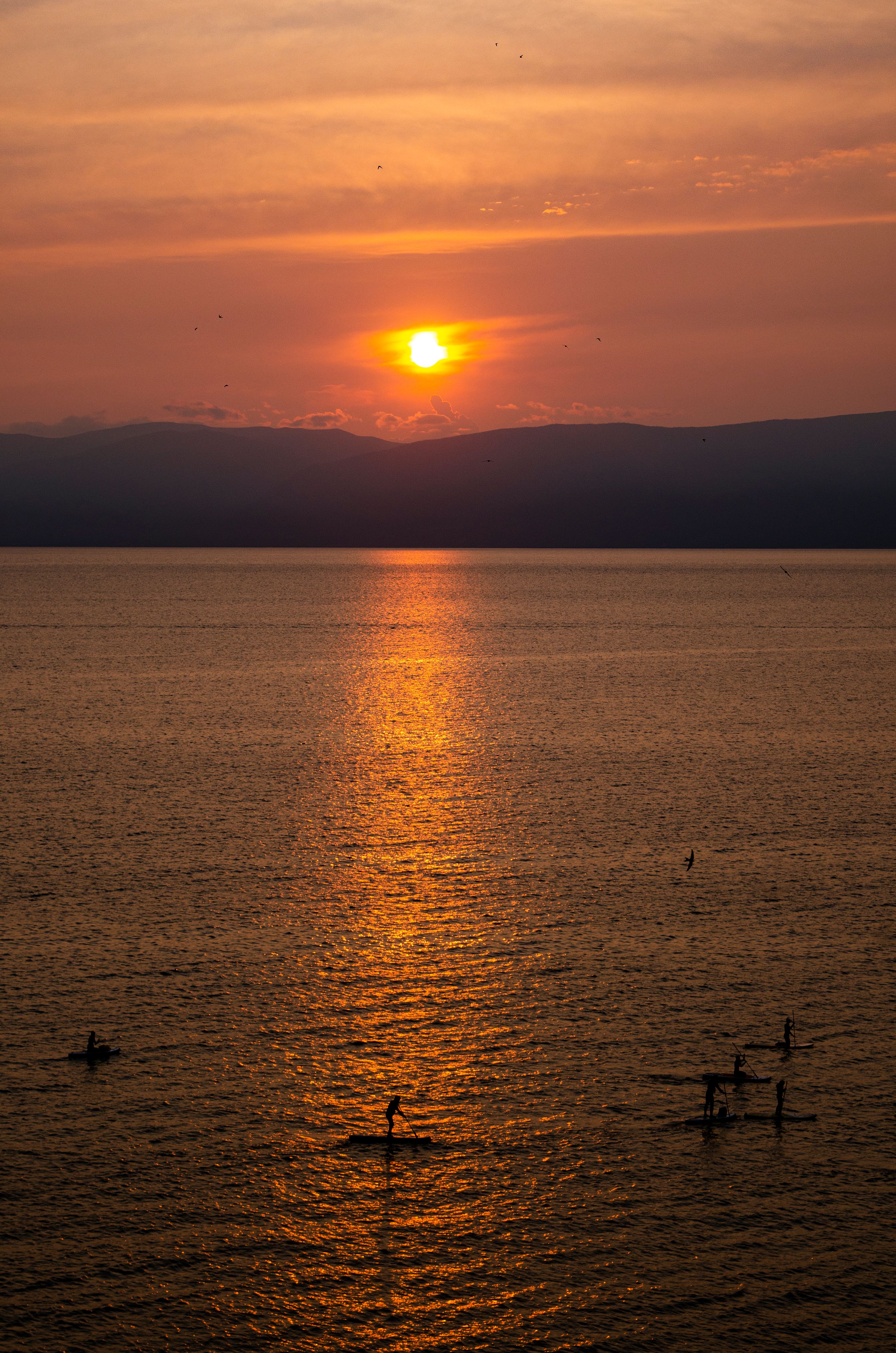 Silhouette of an Island during Sunset · Free Stock Photo