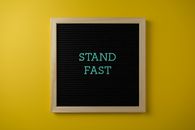 A Black Text Board on Yellow Background