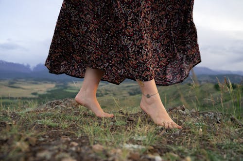 Close-Up Photo of a Woman's Feet with an Anklet