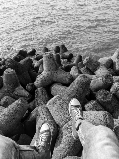 Free stock photo of black and white, canvas shoes, ocean Stock Photo