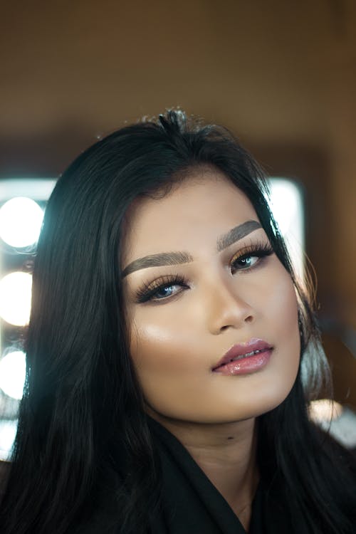 Portrait of a Beautiful Woman with Black Hair Looking at the Camera