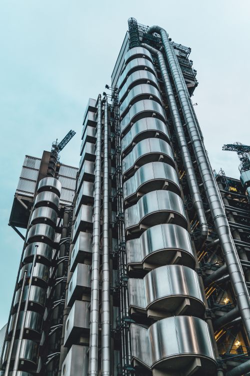 Free Low-angle shot of the iconic Lloyd's Building showcasing its modern, industrial design in London. Stock Photo
