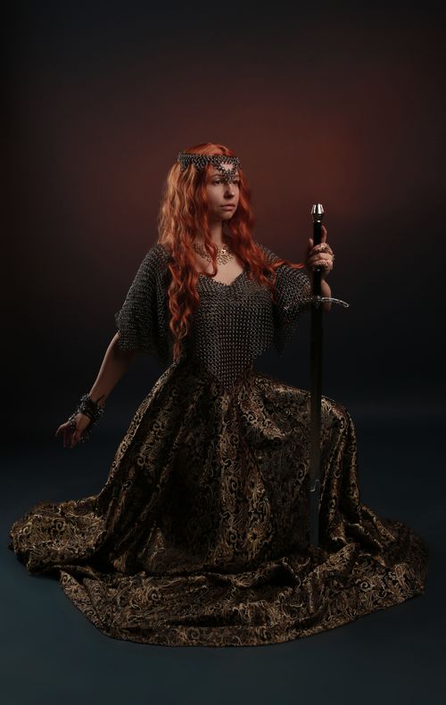 Free Striking portrait of a warrior woman in medieval armor, exuding strength and grace. Stock Photo