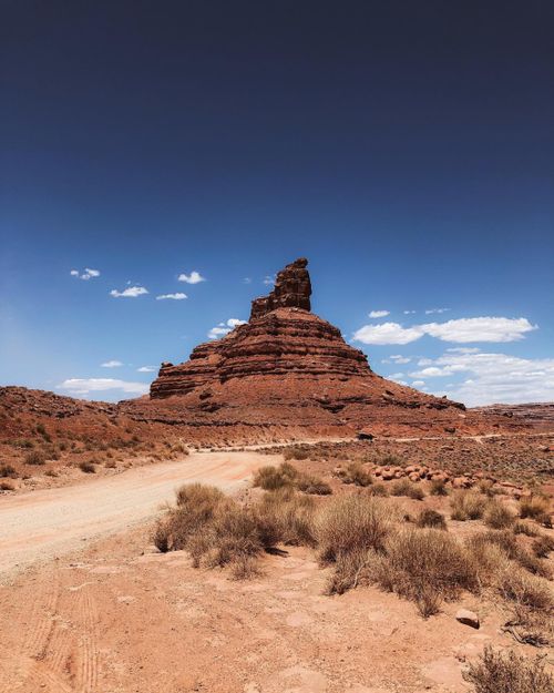 Free Breathtaking view of Mexican Hat rock formation under clear blue sky, capturing Utah's stunning desert scenery. Stock Photo