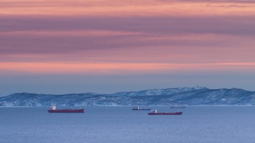 Ferries on the Ocean during Sunset