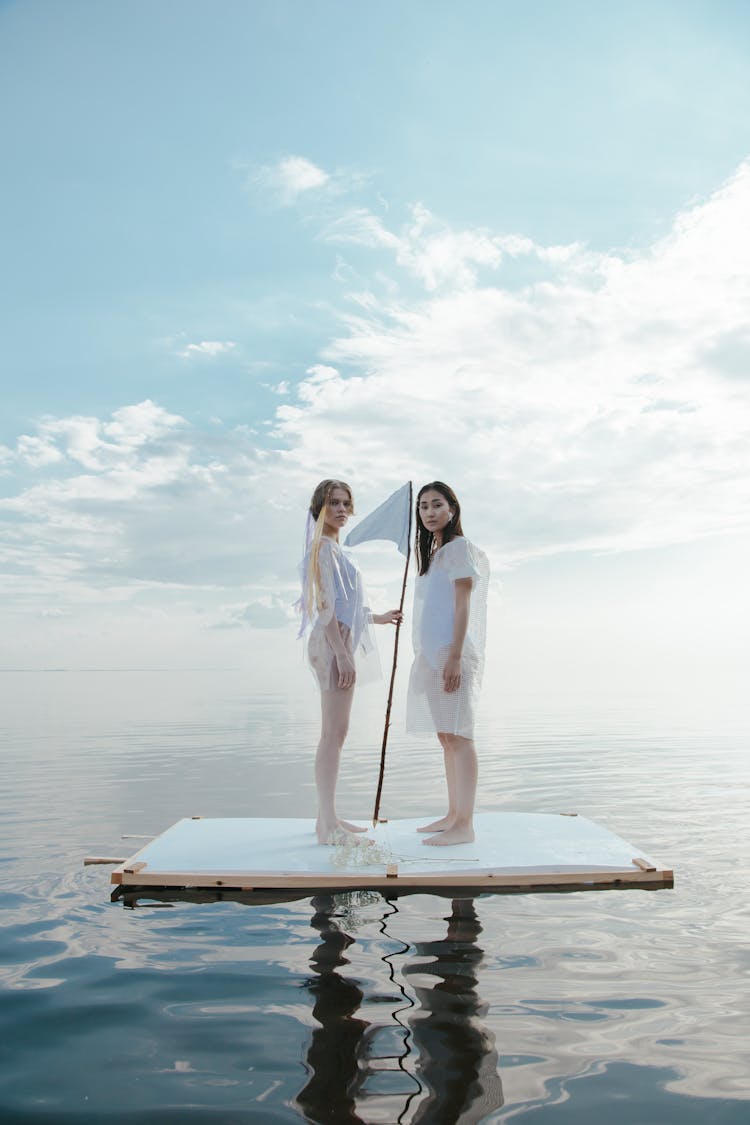 Women Wearing Plastics While On Raft 