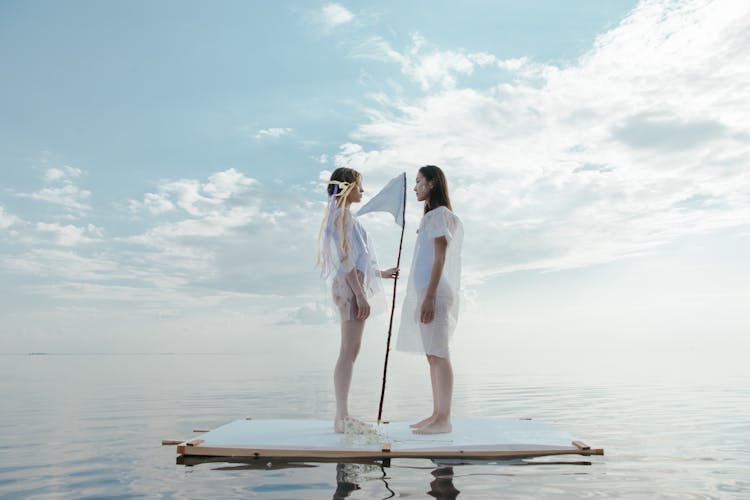 Women Standing On The Raft