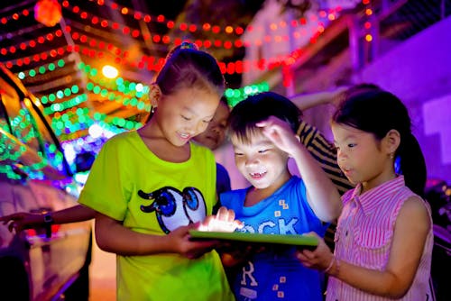 Free Children Using a Digital Tablet Stock Photo