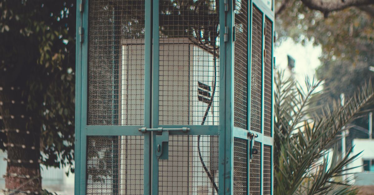 Electricity Main Switch Box in a Cage · Free Stock Photo
