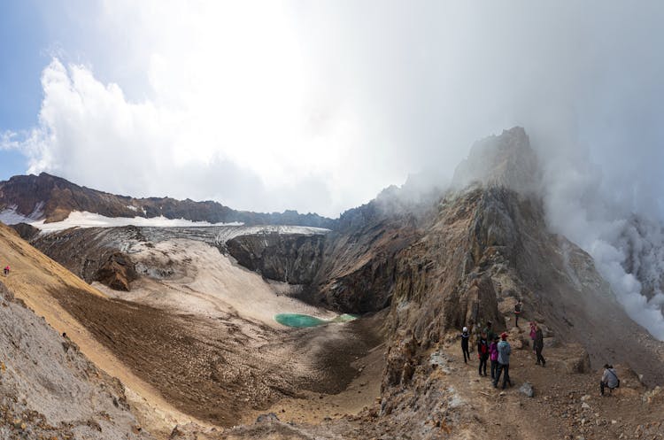 People Hiking In Mountains