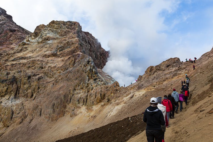 People Hiking On Mountain