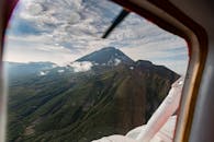 Green and Brown Mountains Under White Clouds