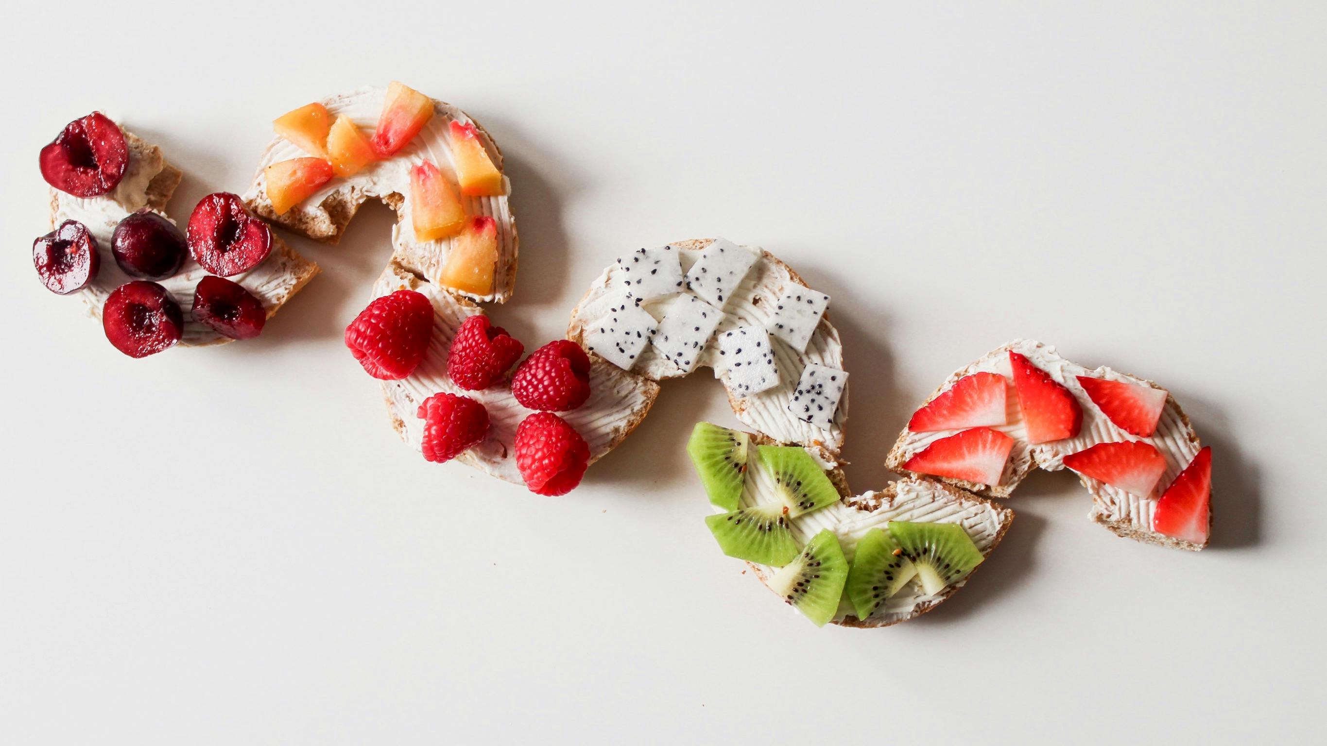 assorted sliced fruit lot on white surface