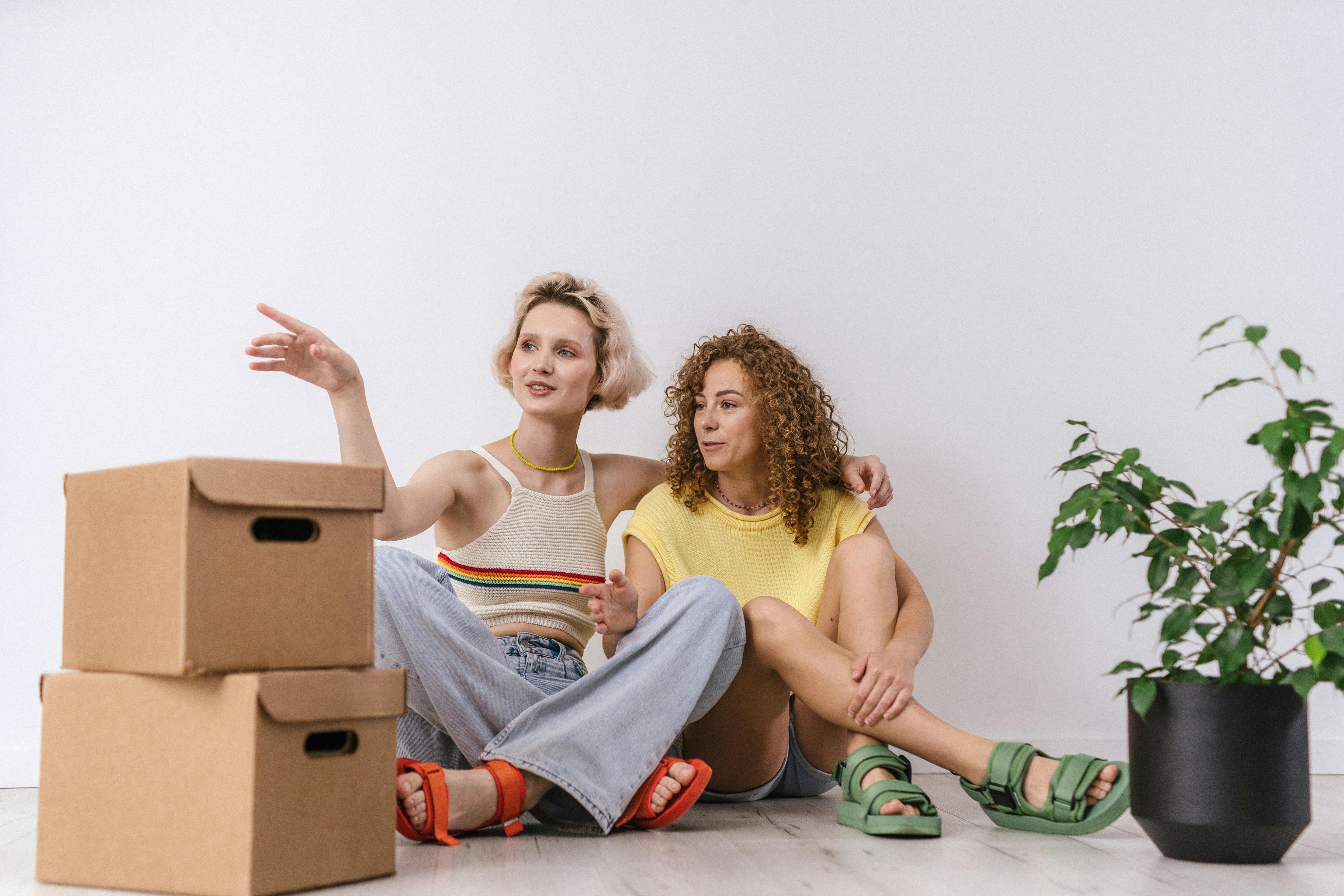 a couple sitting on the floor together