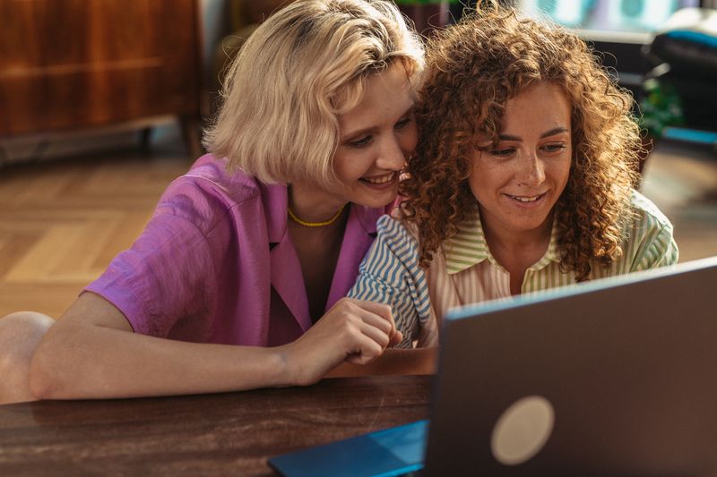 Two colleagues reviewing work on a laptop — photo by SHVETS production on Pexels