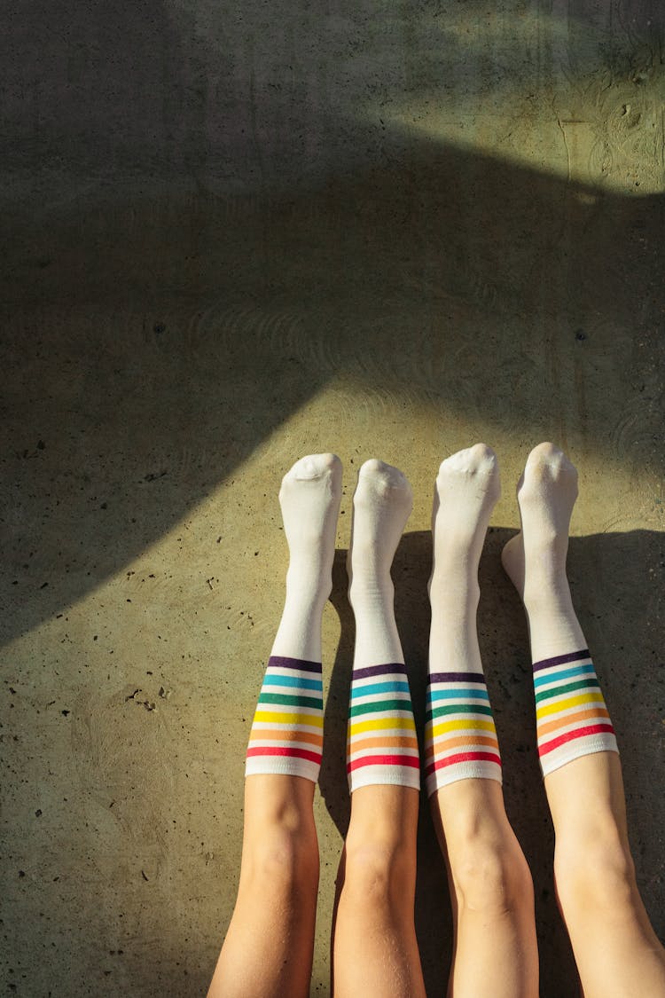 2 Person Wearing Rainbow Socks