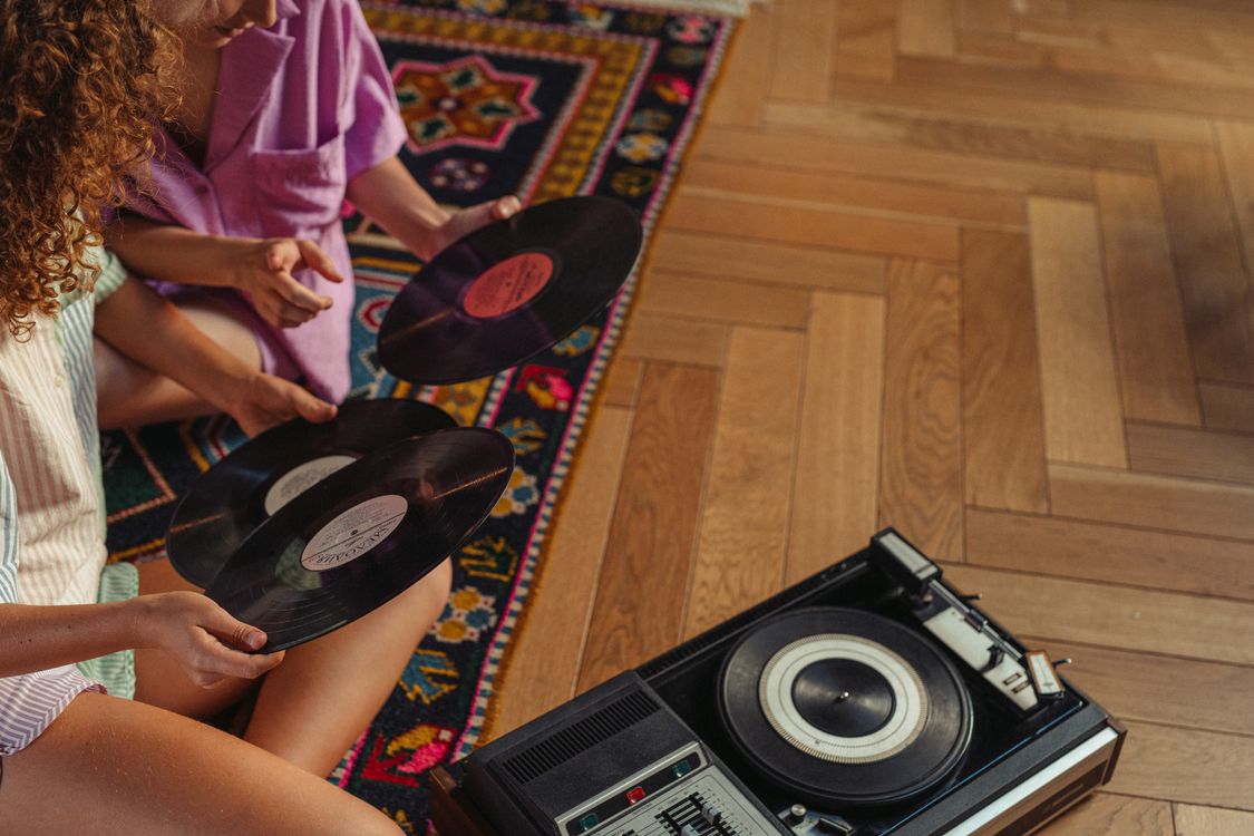People Sitting On The Floor Holding Vinyl Records Free Stock Photo people-sitting-on-the-floor-holding-vinyl-records-free-stock-photo