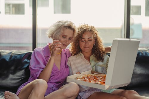 A Couple Looking at a Pizza