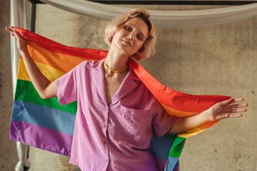 A Woman Holding a Rainbow Flag