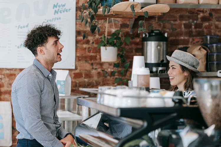 A Man Ordering At A Coffee Shop