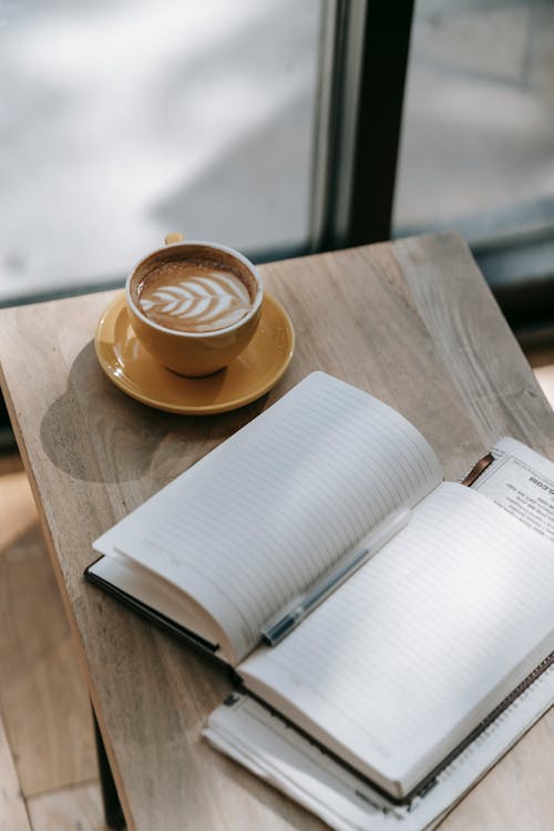 Free Brown Cup with Coffee on the Table Stock Photo