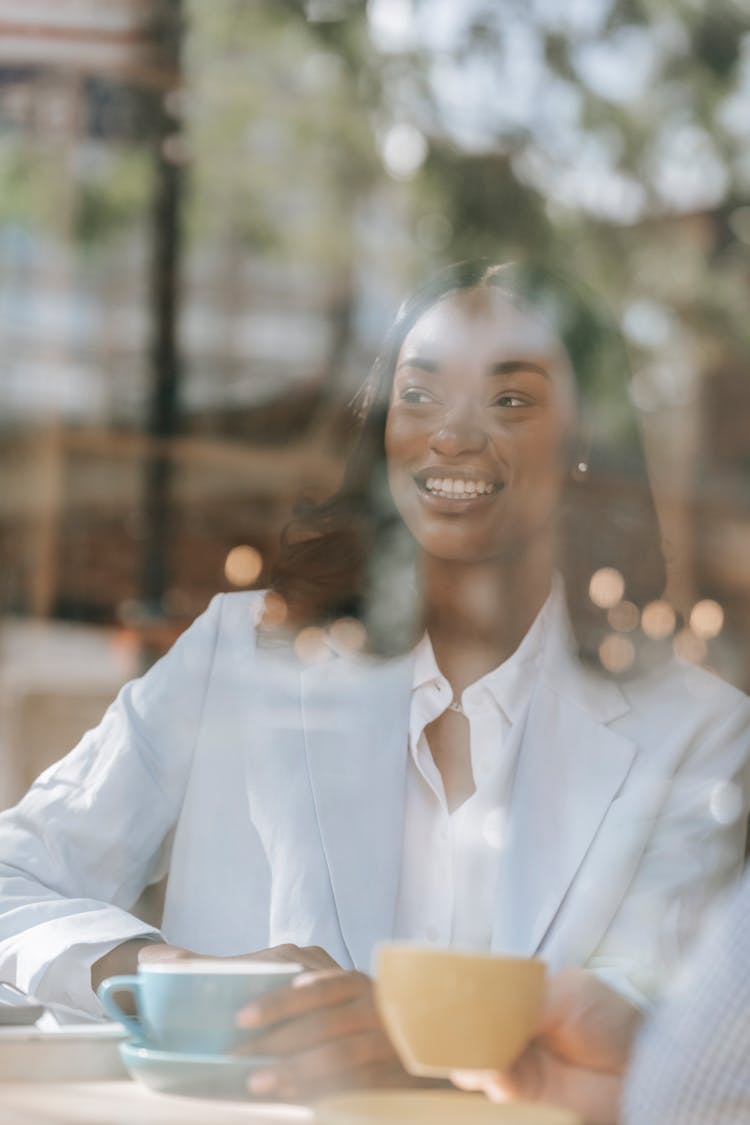 Smiling Woman Behind Window