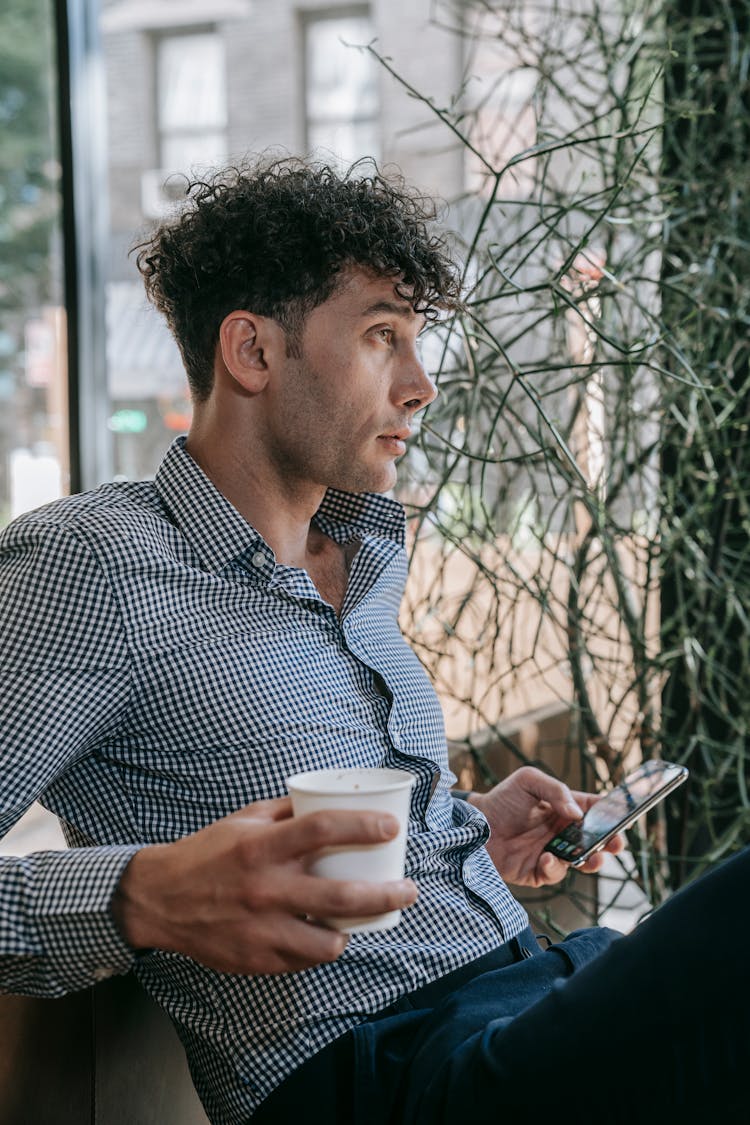 Man With Curly Hair Enjoy Coffee