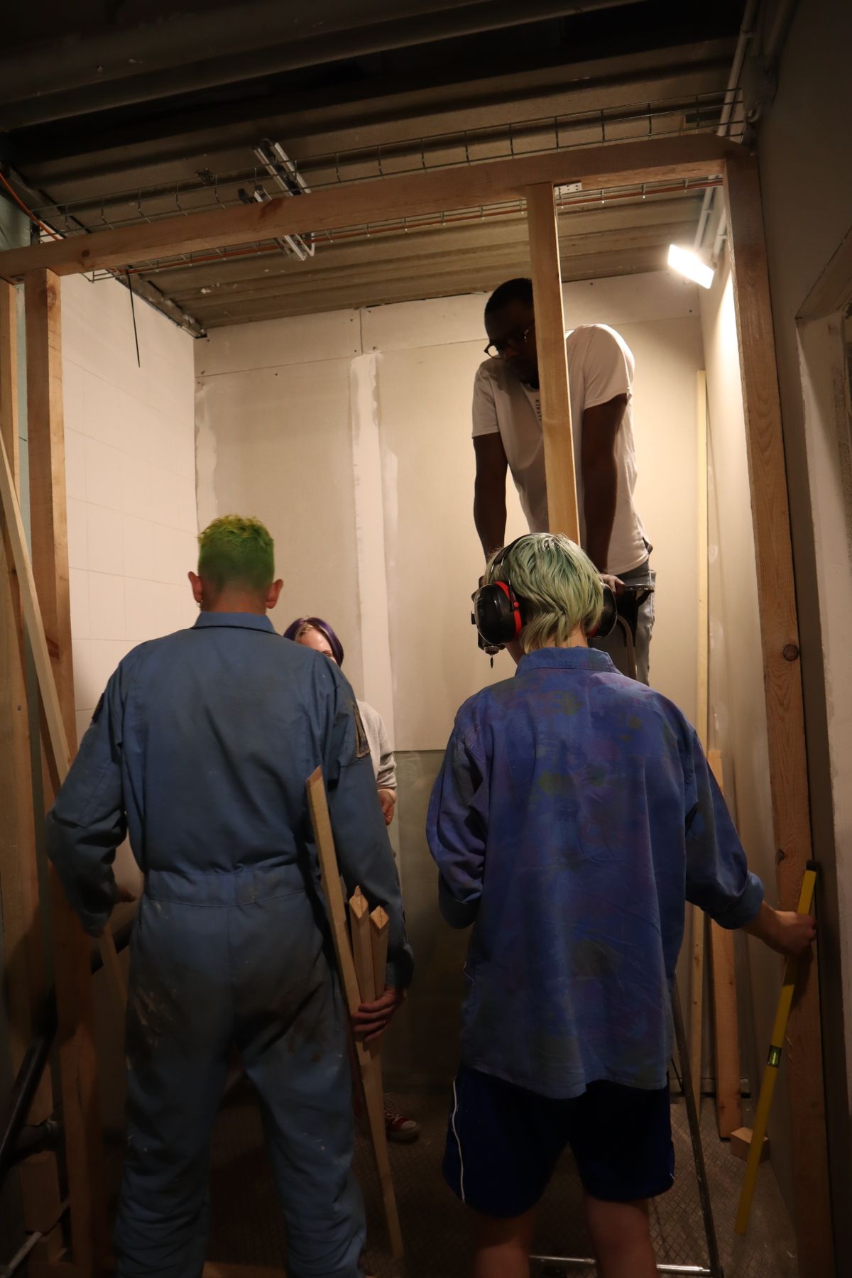 Construction crew framing a wood-framed room addition