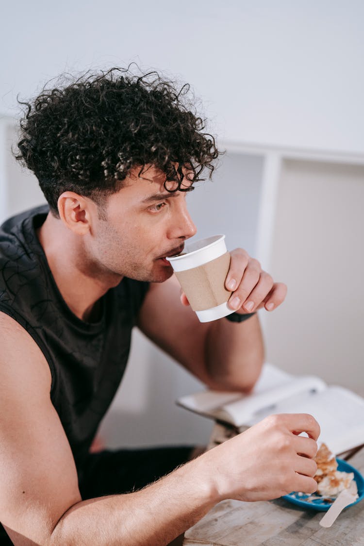 Man With Curly Hair Enjoy Coffee