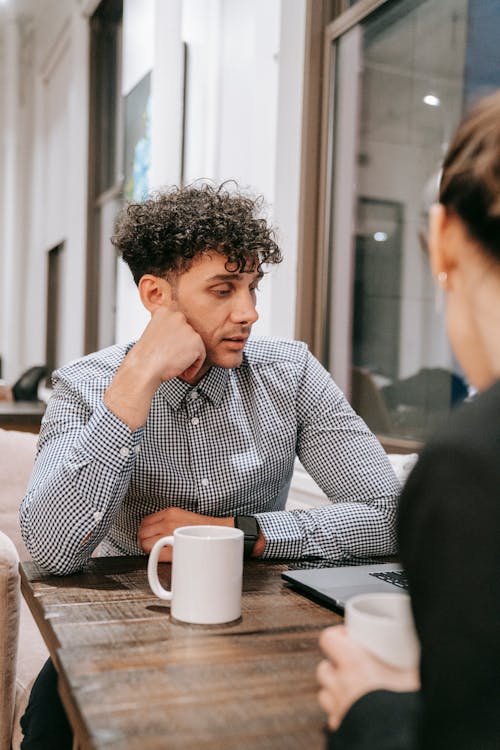 Free A Man Having Coffee at a Table Stock Photo
