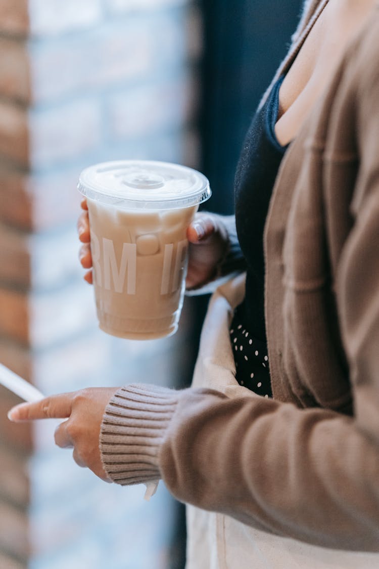 Close-up Of Woman Holding Takeaway Coffee