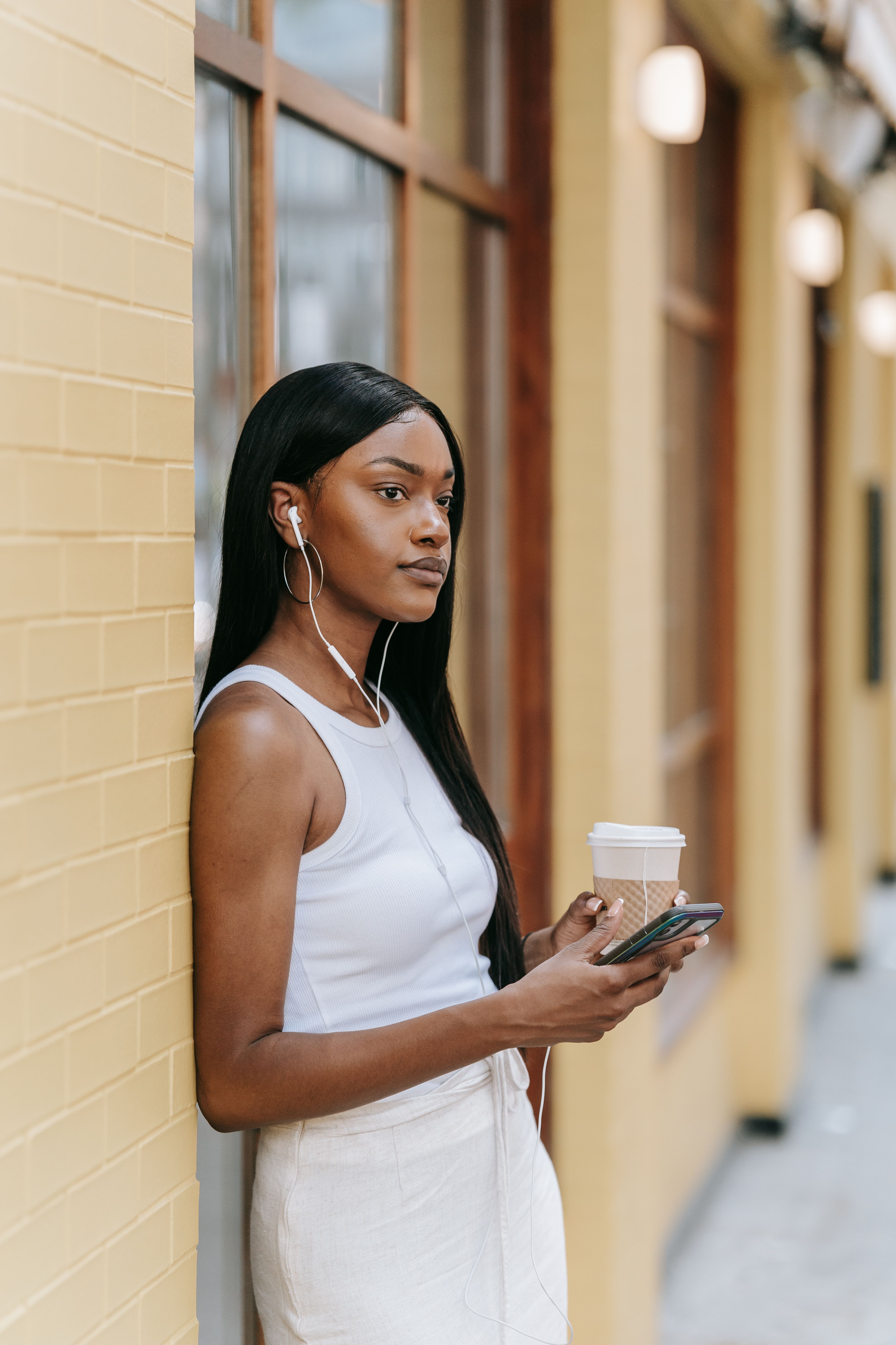 A Woman Standing on the Street · Free Stock Photo